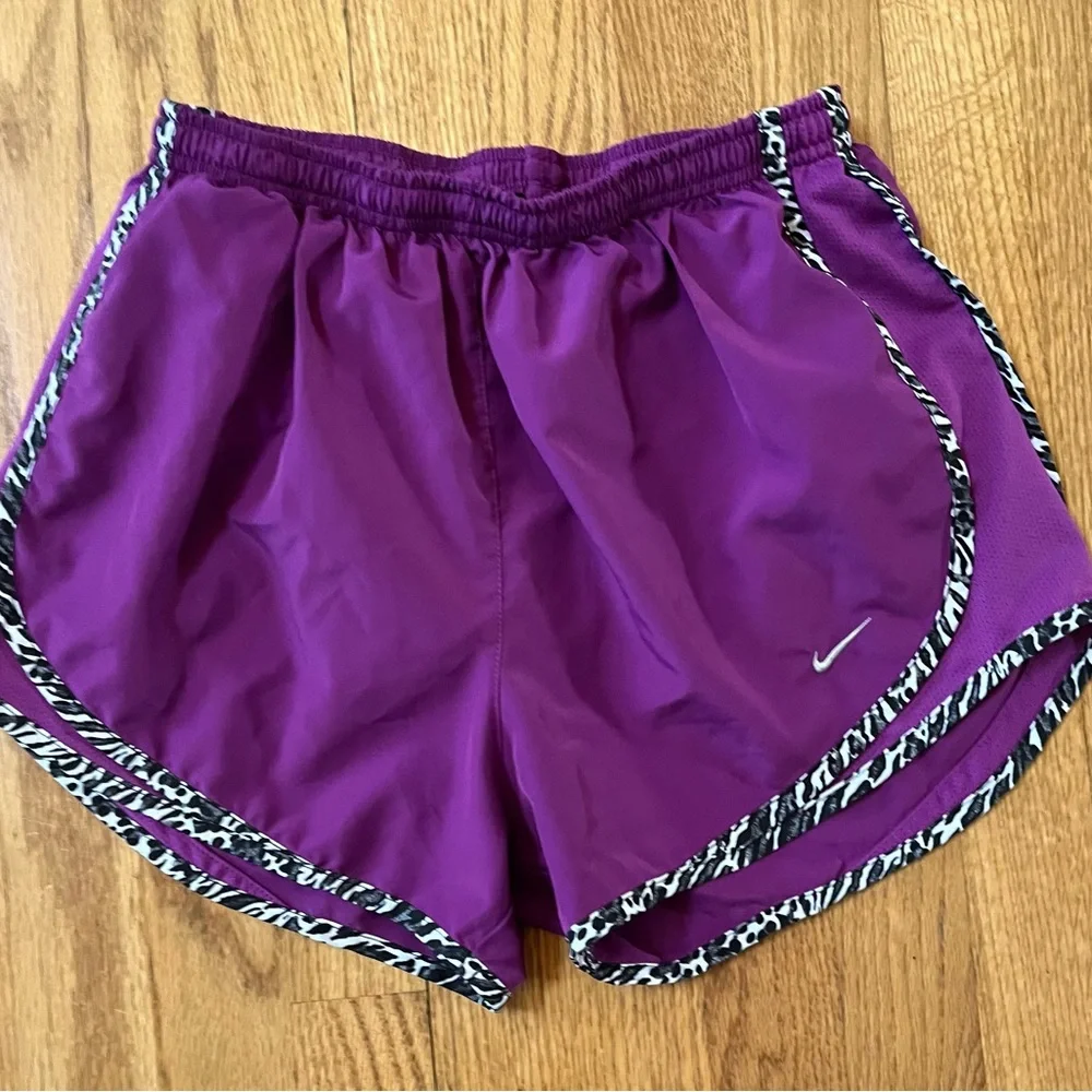 Women’s purple Dri-Fit Nike running shorts with animal print